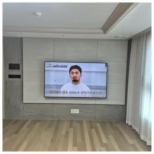 DMC 자이 더리버 벽걸이TV 설치 예시 이미지 · 사진 1